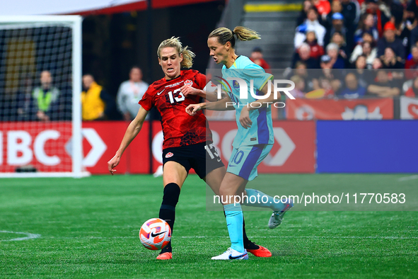 In Vancouver, Canada, on December 5, 2023, S. Schmidt #13 tries to steal the ball from van Egmond #10 during the International Friendly Matc...