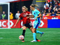 In Vancouver, Canada, on December 5, 2023, S. Schmidt #13 tries to steal the ball from van Egmond #10 during the International Friendly Matc...