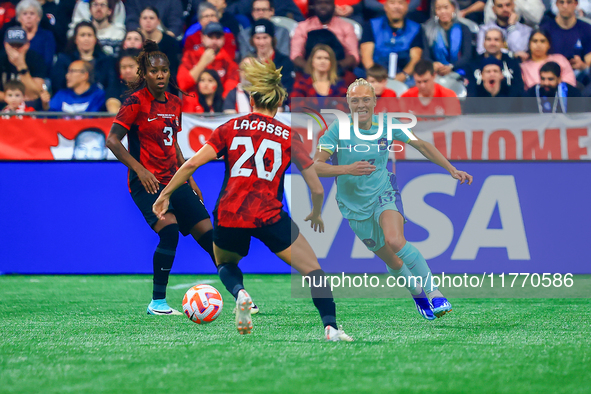 T. Yallop #13 chases the ball in front of C. Lacasse #20 during the International Friendly Match between Canada and Australia at BC Place in...