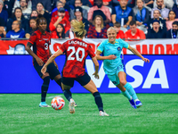 T. Yallop #13 chases the ball in front of C. Lacasse #20 during the International Friendly Match between Canada and Australia at BC Place in...