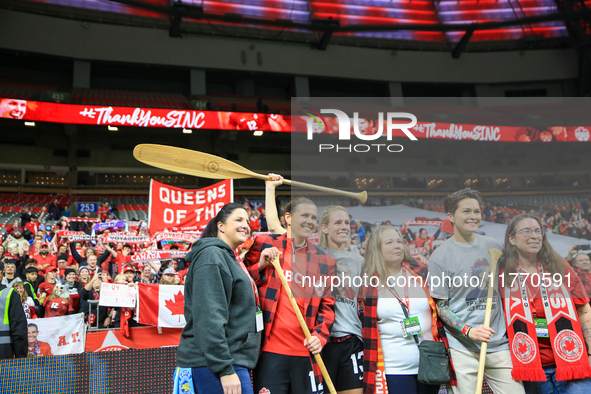 In Vancouver, Canada, on December 5, 2023, Sophie Schmidt, Christine Sinclair, and Erin McLeod take photos with fans during the Internationa...