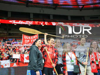 In Vancouver, Canada, on December 5, 2023, Sophie Schmidt, Christine Sinclair, and Erin McLeod take photos with fans during the Internationa...