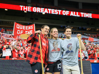 Sophie Schmidt, Christine Sinclair, and Erin McLeod take photos in front of fans during the International Friendly Match between Canada and...