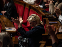 Rassemblement National leader Marine Le Pen stands between the benches of the Assemblee Nationale in Paris, France, on November 12, 2024. (