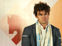 Norway's Magnus Carlsen, along with other chess players Nodirbek Abdusattorov, Wesley So, Vincent Keymer, Daniil Dubov, Arjun Erigaisi, R Pr...