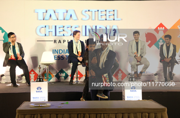 India's Rameshbabu Praggnanandhaa poses with the world's youngest chess player, India's Anish Sarkar, during the 6th Tata Steel Chess India...