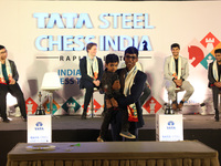 India's Rameshbabu Praggnanandhaa poses with the world's youngest chess player, India's Anish Sarkar, during the 6th Tata Steel Chess India...