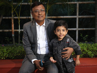 Dibyendu Barua, an Indian chess grandmaster and three-time Indian Chess Champion, poses with India's Anish Sarkar, the world's youngest ches...