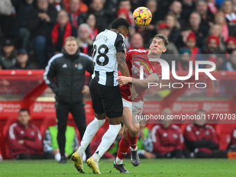 Ryan Yates of Nottingham Forest battles with Joe Willock of Newcastle United during the Premier League match between Nottingham Forest and N...