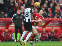 Ryan Yates of Nottingham Forest battles with Joe Willock of Newcastle United during the Premier League match between Nottingham Forest and N...