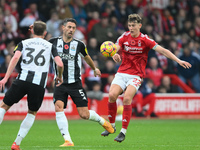 Ryan Yates of Nottingham Forest puts pressure on Fabian Sch?r of Newcastle United during the Premier League match between Nottingham Forest...