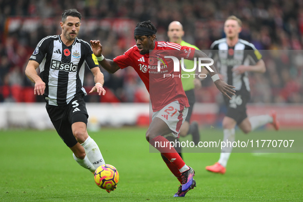 Anthony Elanga of Nottingham Forest is under pressure from Fabian Schar of Newcastle United during the Premier League match between Nottingh...