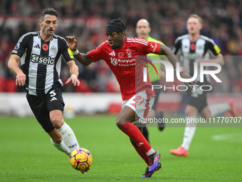 Anthony Elanga of Nottingham Forest is under pressure from Fabian Schar of Newcastle United during the Premier League match between Nottingh...