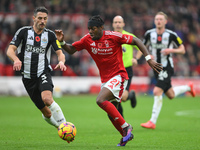 Anthony Elanga of Nottingham Forest is under pressure from Fabian Schar of Newcastle United during the Premier League match between Nottingh...