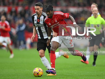 Anthony Elanga of Nottingham Forest is under pressure from Fabian Schar of Newcastle United during the Premier League match between Nottingh...