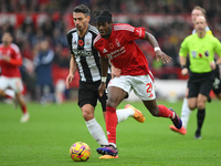 Anthony Elanga of Nottingham Forest is under pressure from Fabian Schar of Newcastle United during the Premier League match between Nottingh...