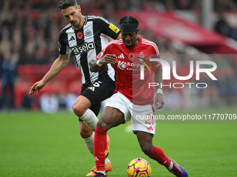 Anthony Elanga of Nottingham Forest is under pressure from Fabian Schar of Newcastle United during the Premier League match between Nottingh...