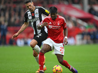 Anthony Elanga of Nottingham Forest is under pressure from Fabian Schar of Newcastle United during the Premier League match between Nottingh...