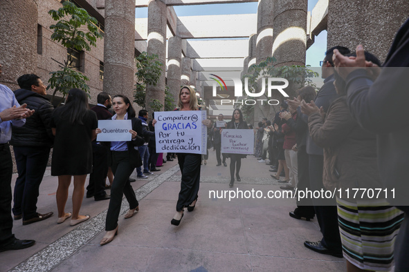 Judicial Branch workers participate in a ceremony to bid farewell to judges and magistrates who resign from voting to keep their posts at th...