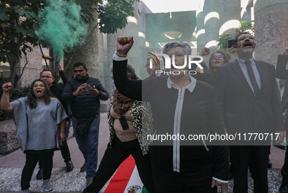 Judicial Branch workers participate in a ceremony to bid farewell to judges and magistrates who resign from voting to keep their posts at th...