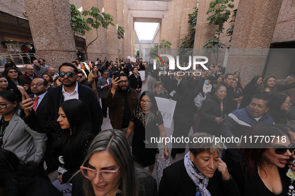 Judicial Branch workers participate in a ceremony to bid farewell to judges and magistrates who resign from voting to keep their posts at th...