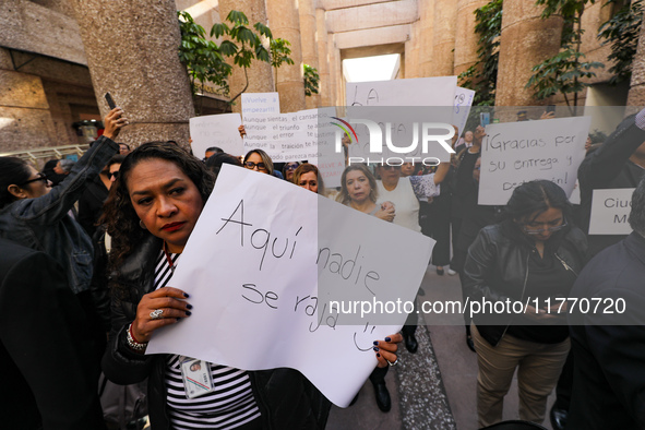 Judicial Branch workers participate in a ceremony to bid farewell to judges and magistrates who resign from voting to keep their posts at th...