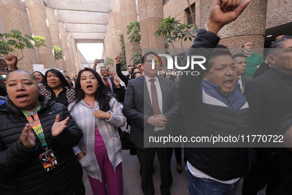 Judicial Branch workers participate in a ceremony to bid farewell to judges and magistrates who resign from voting to keep their posts at th...