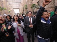 Judicial Branch workers participate in a ceremony to bid farewell to judges and magistrates who resign from voting to keep their posts at th...