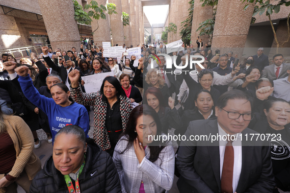 Judicial Branch workers participate in a ceremony to bid farewell to judges and magistrates who resign from voting to keep their posts at th...