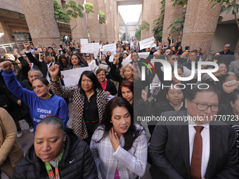 Judicial Branch workers participate in a ceremony to bid farewell to judges and magistrates who resign from voting to keep their posts at th...