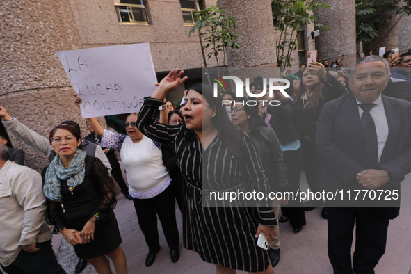 Judicial Branch workers participate in a ceremony to bid farewell to judges and magistrates who resign from voting to keep their posts at th...