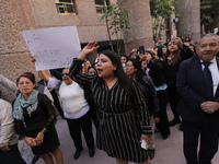 Judicial Branch workers participate in a ceremony to bid farewell to judges and magistrates who resign from voting to keep their posts at th...