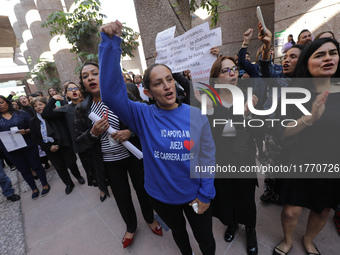 Judicial Branch workers participate in a ceremony to bid farewell to judges and magistrates who resign from voting to keep their posts at th...