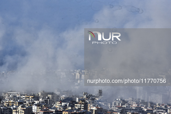 Smoke rises from the site of an Israeli airstrike that targets a neighborhood in Beirut's southern suburbs on November 12, 2024. 