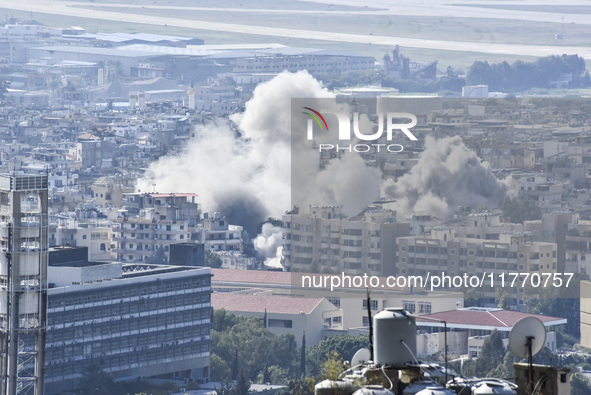 Smoke rises from the site of an Israeli airstrike that targets a neighborhood in Beirut's southern suburbs on November 12, 2024. 