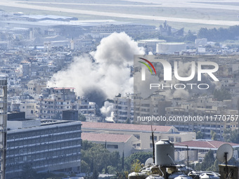 Smoke rises from the site of an Israeli airstrike that targets a neighborhood in Beirut's southern suburbs on November 12, 2024. (