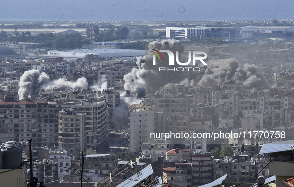 Smoke rises from the site of an Israeli airstrike that targets a neighborhood in Beirut's southern suburbs on November 12, 2024. 