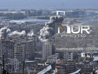 Smoke rises from the site of an Israeli airstrike that targets a neighborhood in Beirut's southern suburbs on November 12, 2024. (