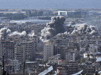 Smoke rises from the site of an Israeli airstrike that targets a neighborhood in Beirut's southern suburbs on November 12, 2024. (