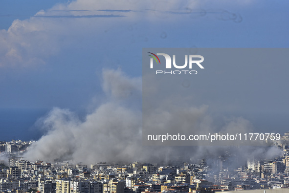 Smoke rises from the site of an Israeli airstrike that targets a neighborhood in Beirut's southern suburbs on November 12, 2024. 