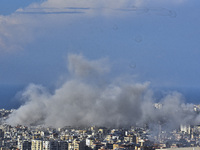 Smoke rises from the site of an Israeli airstrike that targets a neighborhood in Beirut's southern suburbs on November 12, 2024. (