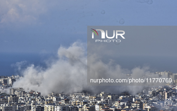 Smoke rises from the site of an Israeli airstrike that targets a neighborhood in Beirut's southern suburbs on November 12, 2024. 