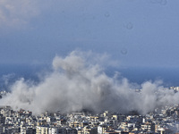 Smoke rises from the site of an Israeli airstrike that targets a neighborhood in Beirut's southern suburbs on November 12, 2024. (