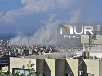 Smoke rises from the site of an Israeli airstrike that targets a neighborhood in Beirut's southern suburbs on November 12, 2024. (