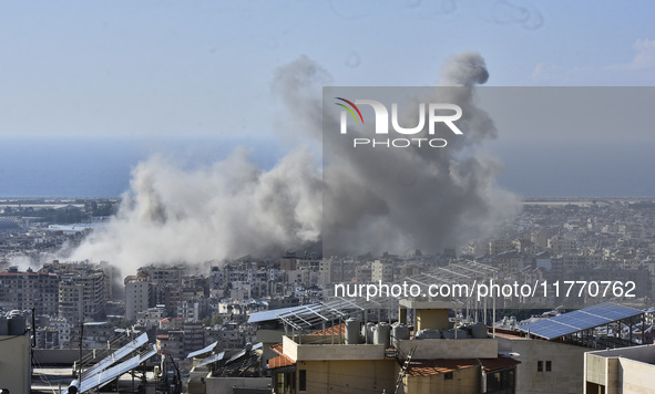 Smoke rises from the site of an Israeli airstrike that targets a neighborhood in Beirut's southern suburbs on November 12, 2024. 