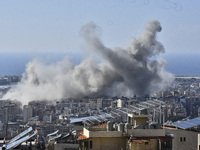 Smoke rises from the site of an Israeli airstrike that targets a neighborhood in Beirut's southern suburbs on November 12, 2024. (