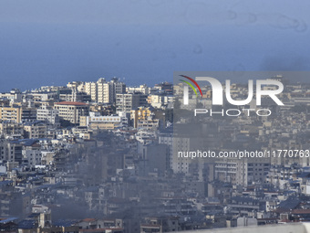 Smoke rises from the site of an Israeli airstrike that targets a neighborhood in Beirut's southern suburbs on November 12, 2024. (