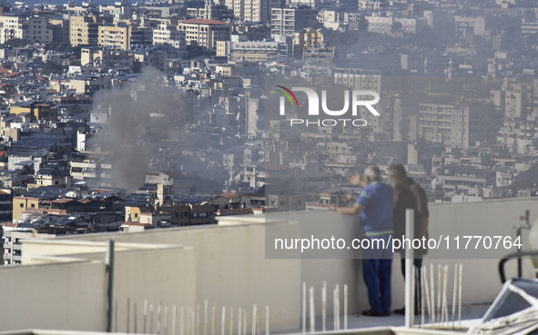 Smoke rises from the site of an Israeli airstrike that targets a neighborhood in Beirut's southern suburbs on November 12, 2024. 