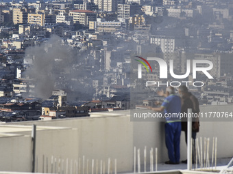 Smoke rises from the site of an Israeli airstrike that targets a neighborhood in Beirut's southern suburbs on November 12, 2024. (