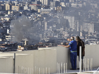 Smoke rises from the site of an Israeli airstrike that targets a neighborhood in Beirut's southern suburbs on November 12, 2024. (